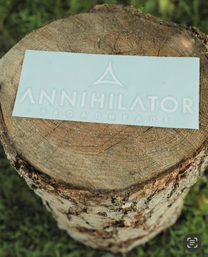 annihilator logo placed on a log